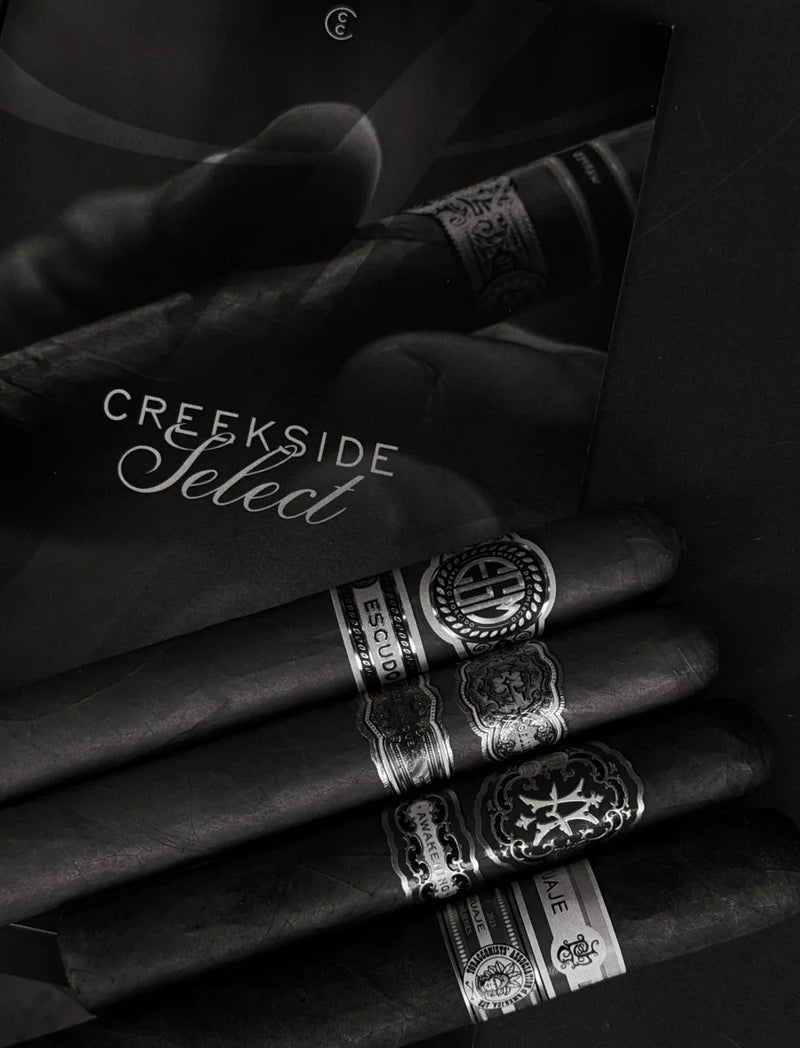 Creekside Select quarterly club box with premium cigars and the Select booklet