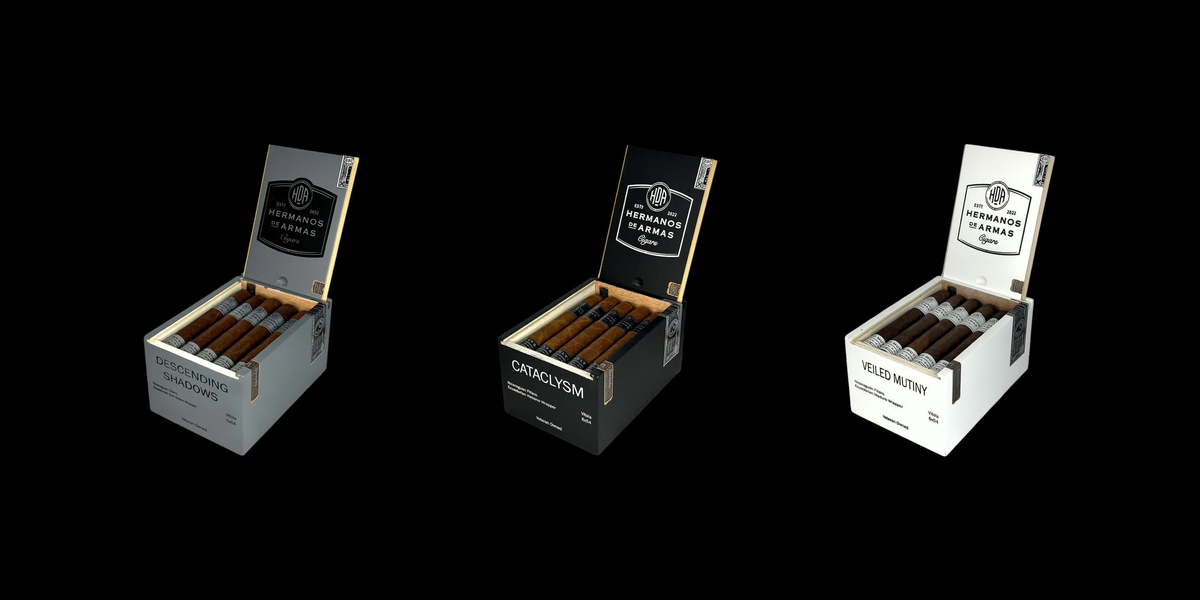 3 cigar boxes on black background