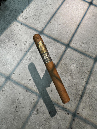 photo of cigar with black and gold label 