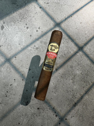 Cigar with a label on a concrete surface