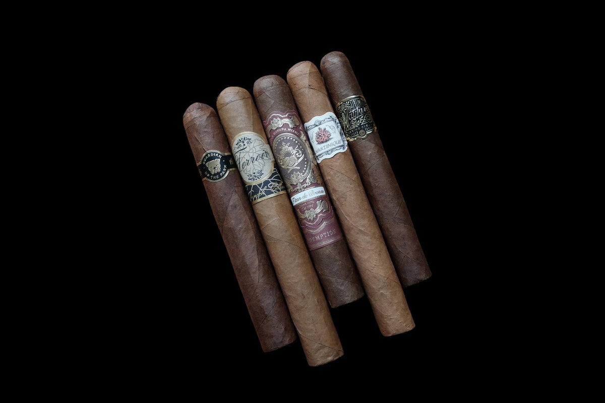 Five cigars on a black Background 
