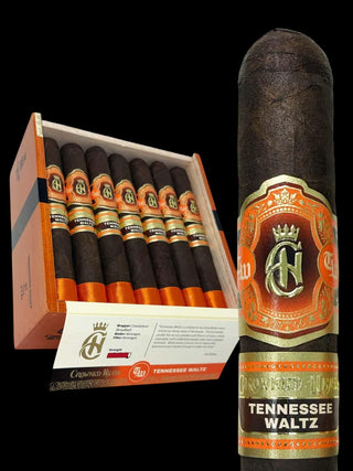 A single dark brown Tennessee Waltz cigar shown upright next to an open box of matching cigars, with branded orange, gold, and white labels visible against a black background.