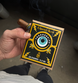 Photo Of Cigar with a label that says "thunder kiss"