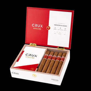 Open box of Crux Epicure cigars with cigars inside on a black background