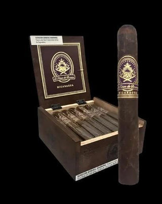 Cigar with packaging and cigars in a wooden box on a black background