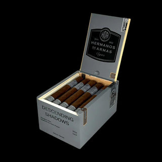 Open box of cigars with 'Hermanos de Armas' branding on a white background