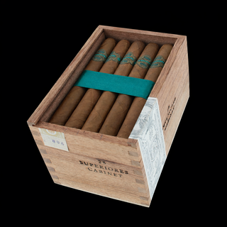 Open cabinet box of Warped La Hacienda Superiores cigars showing 25 count with teal ribbon