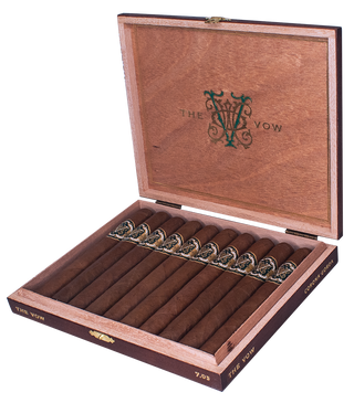 Wooden cigar box with cigars inside, featuring 'The Vow' branding.